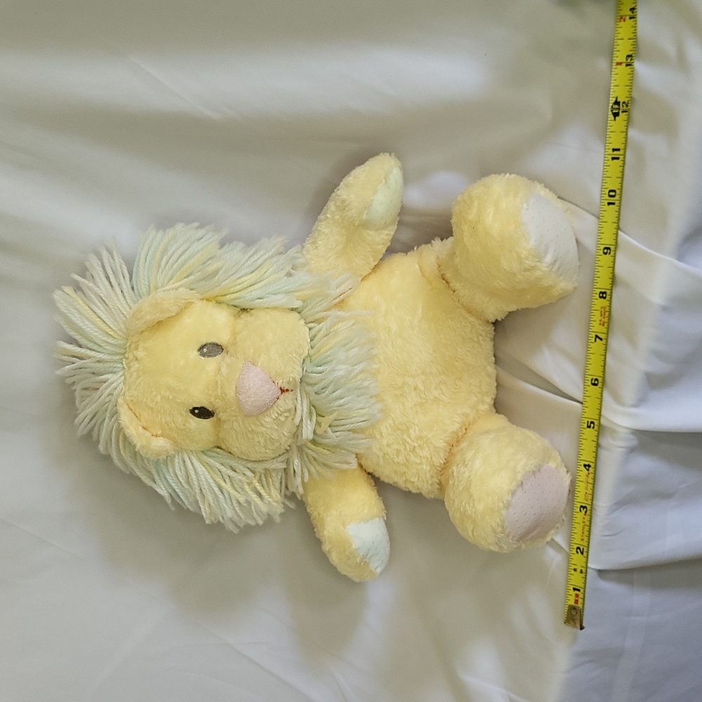 Snaglepuss Lion Rattle Baby Plush Textured paws Pastel yellow fabric eyes